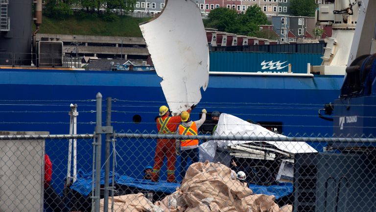 Debris from the Titan submersible, recovered from the ocean floor near the wreck of the Titanic, is unloaded from the ship Horizon Arctic at the Canadian Coast Guard pier in St. John&#39;s, Newfoundland 
PicThe Canadian Press /AP
