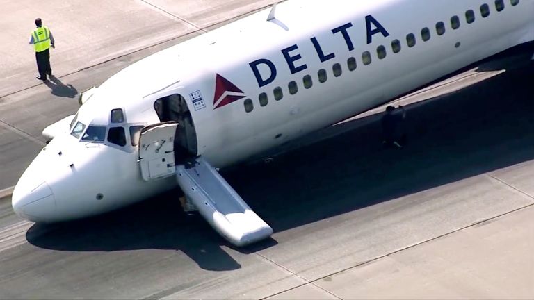 A Delta plane lands without its landing gear at the Charlotte Douglas International Airport
Pic:WSOC-TV/AP