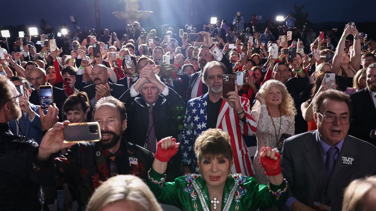 People react as former U.S. President Donald Trump delivers remarks following his arraignment on classified document charges, at Trump National Golf Club, in Bedminster, New Jersey, U.S., June 13, 2023. REUTERS/Amr Alfiky