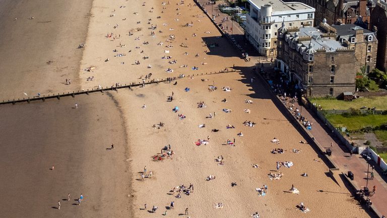 People on Portobello Beach, Edinburgh, enjoying the warm weather on what is believed to be the hottest day so far this year in Scotland. Picture date: Tuesday May 30, 2023.