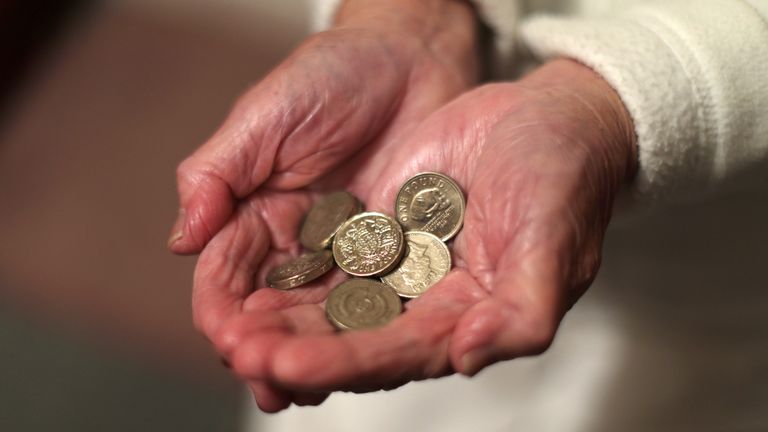 File photo dated 22/12/2016 of an elderly woman holding pound coins in her hands, in Poole, Dorset.