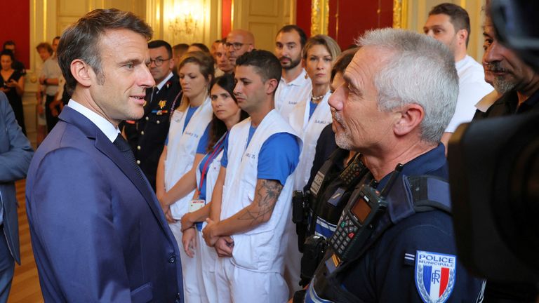 Mr Macron met with emergency services workers. Pic: AP