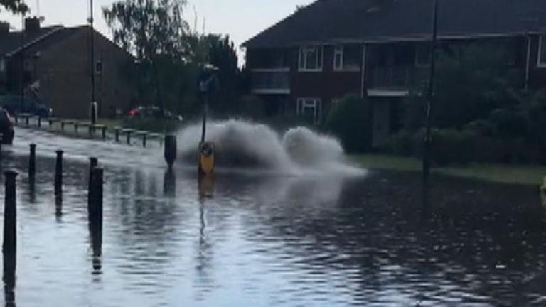 Car momentarily disappears while driving through floodwater in Maidenhead