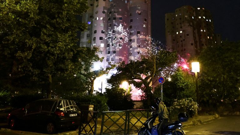 Protesters throw fireworks in the Paris suburb of Nanterre in France