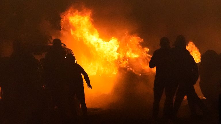 Youths clash with police in the Paris suburb of Nanterre, France. Pic: AP