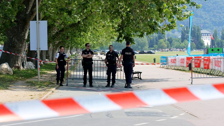 Police at the scene after the attack. Reuters/Denis Balibouse