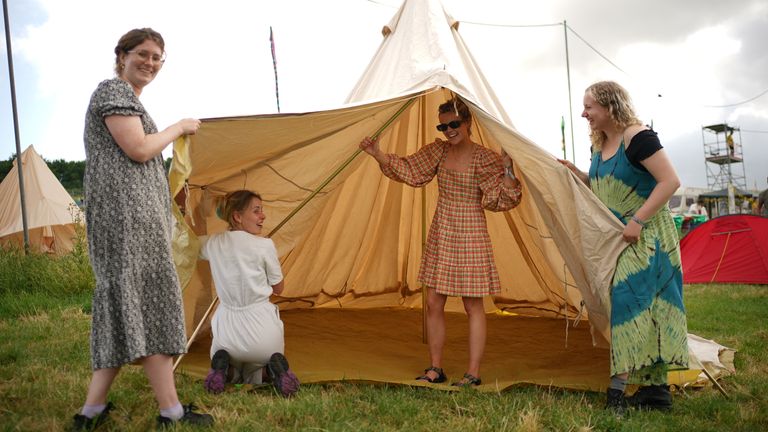 (left to right) Rebecca Cooper, Lottie Mayer, Lizzie Dunn and Imi Regnart-Butler erect their teepee on the first day of the Glastonbury Festival at Worthy Farm in Somerset. Picture date: Wednesday June 21, 2023.