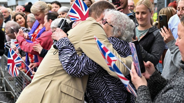 Prince William hugs a person, during his visit to Belfast, Northern Ireland