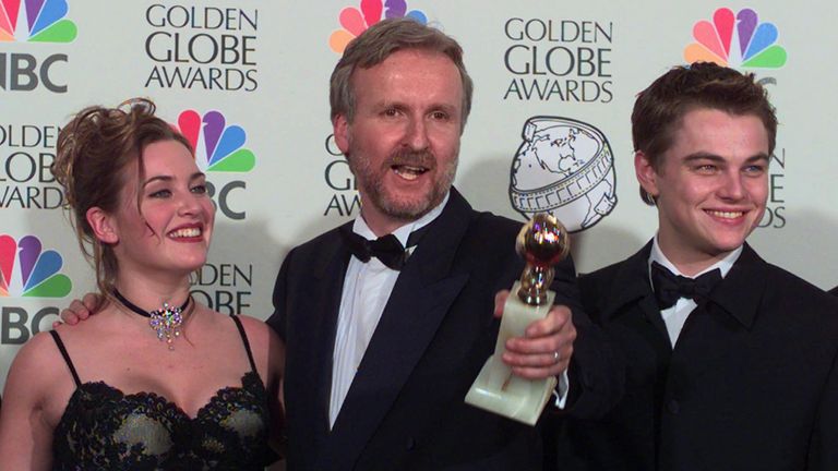 Director James Cameron, center, poses with Kate Winslet and Leonardo DiCaprio after winning the awards for Best Dramatic Motion Picture and Best Director for the film "Titanic" at the 55th Annual Golden Globe Awards in Beverly Hills, Calif., Sunday, Jan. 18, 1998. (AP Photo/Mark J. Terrill)