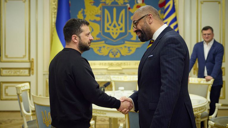 James Cleverly shakes hands with Volodymyr Zelenskyy. Pic: AP