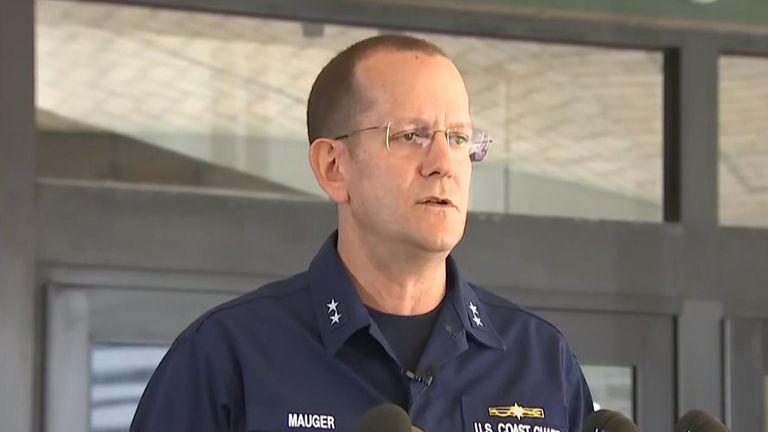Rear Admiral John Mauger, commander of the First Coast Guard District speaks at a press conference in Boston