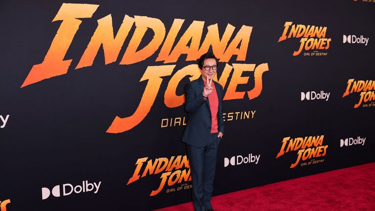 Ke Huy Quan poses for photos are the Indiana Jones premiere