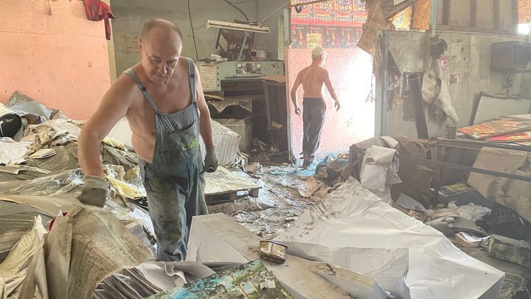 Printworks employee tries to clean up the devastation 