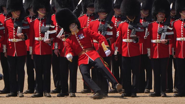 A member of the military fainting due to the heat during the Colonel&#39;s Review, for Trooping the Colour. Pic: PA
