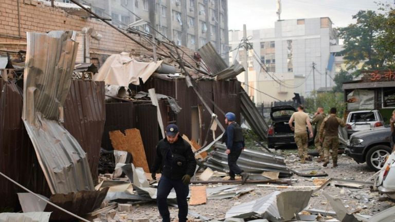 Police and rescue workers   walk in front of a restaurant RIA Pizza destroyed by a Russian attack in Kramatorsk, Ukraine
Pic:National Police of Ukraine/AP