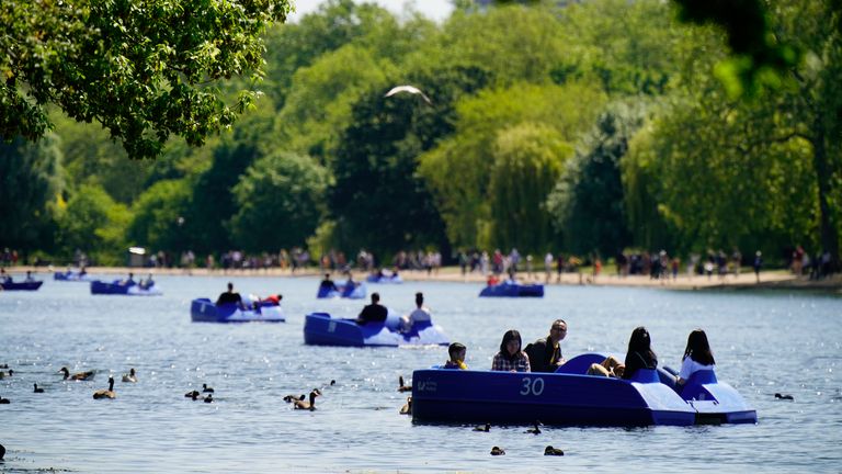 People ride pedalo and rowing boats in the hot weather on the Serpentine in Hyde Park, in London. The UK could experience the hottest day of the year so far, with temperatures potentially reaching a balmy 26C. Picture date: Sunday June 4, 2023.