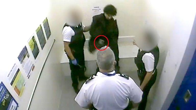 Louis De Zoysa (centre, top) who is holding an item (circled in red) in his hand, seconds before Sergeant Matt Ratana (centre) was fatally shot inside a custody block at Croydon custody centre