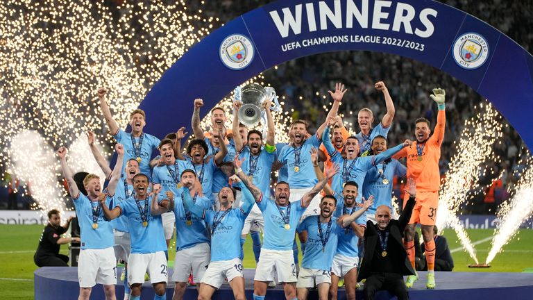 Manchester City&#39;s team captain Ilkay Gundogan lifts the trophy after winning the Champions League final.Pic: AP