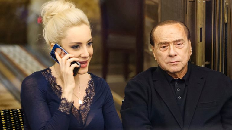 Silvio Berlusconi, right, and his partner Marta Fascina are pictured in Milan, Italy, on Feb. 25, 2022.  
Pic:AP