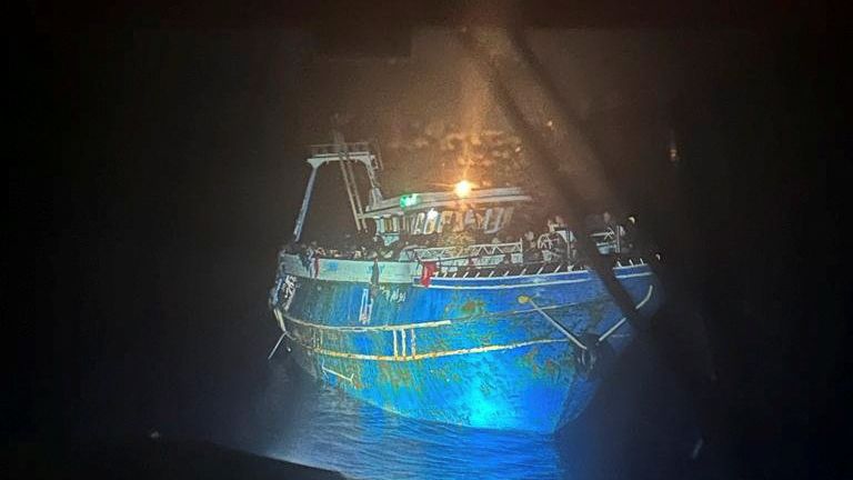 Migrants onboard a boat during a rescue operation, before their boat capsized at open sea, off Greece
Pic:Hellenic Coast Guard/Reuters