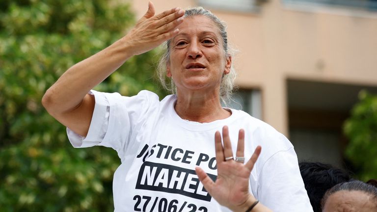 Mounia, the mother of Nahel, a 17-year-old teenager killed by a French police officer in Nanterre during a traffic stop, blows a kiss to the crowd as she attends a march in tribute to his son in Nanterre, Paris suburb, France, June 29, 2023. REUTERS/Sarah Meyssonnier

