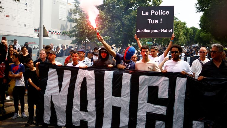 People attend a march in tribute to Nahel, a 17-year-old teenager killed by a French police officer during a traffic stop, in Nanterre, Paris suburb, France, June 29, 2023. The slogan reads "Police kill. Justice for Nahel". REUTERS/Sarah Meyssonnier
