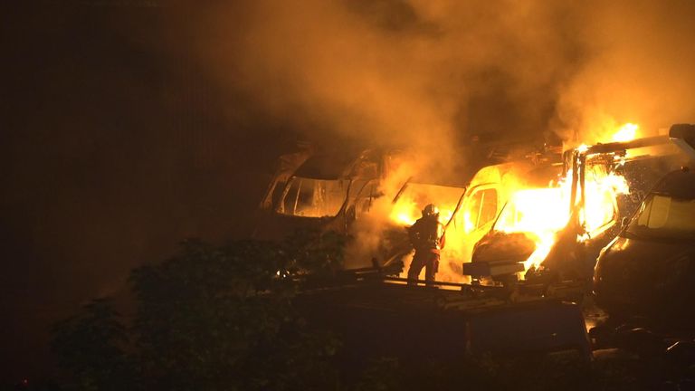 This image of a firefighter tackling car fires in Nanterre was taken by the Sky news team there