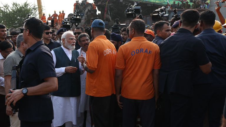 Narendra Modi at the crash site on Saturday. Pic: Government of India