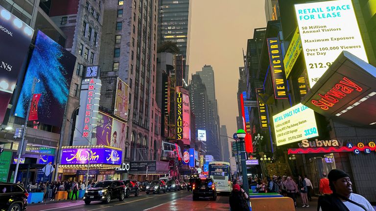 Times Square in Manhattan is shrouded in haze and smoke which drifted south from wildfires in Canada, in New York City, New York, U.S., June 6, 2023. REUTERS/Maye-E Wong