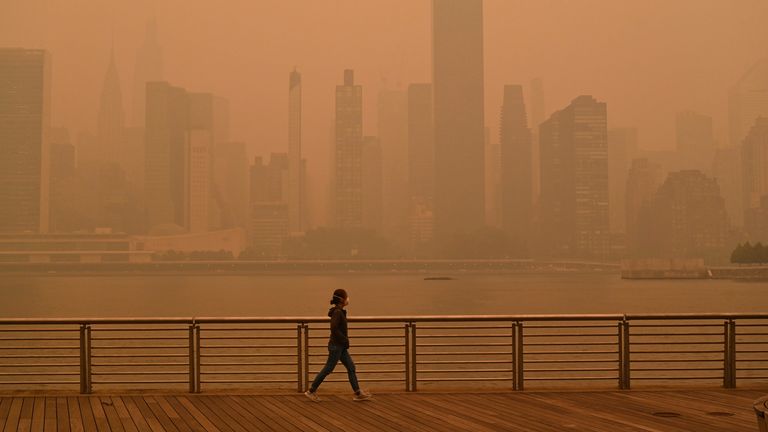A walker in a smoggy New York