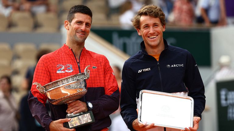 Novak Djokovic and Casper Ruud pose with their trophies
