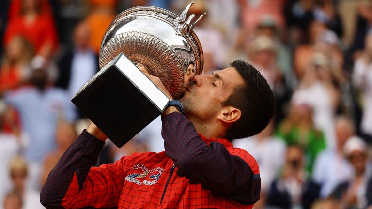 Novak Djokovic kisses the French Open trophy