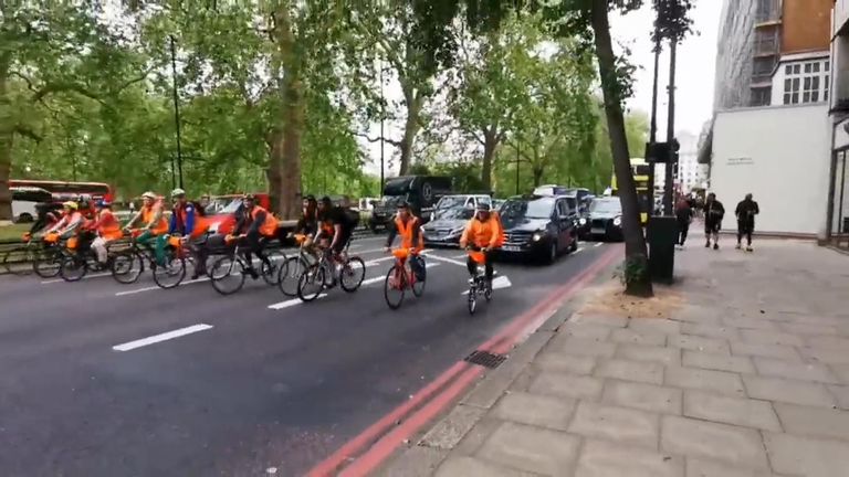 Just Stop Oil activists slow cycled down Park Lane in London to demand an end to fossil fuels. 