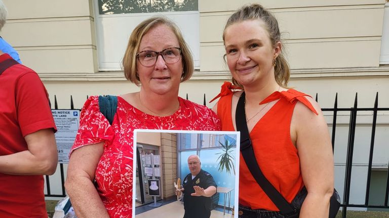 Kim and Louise Nutt with a photo of Paul