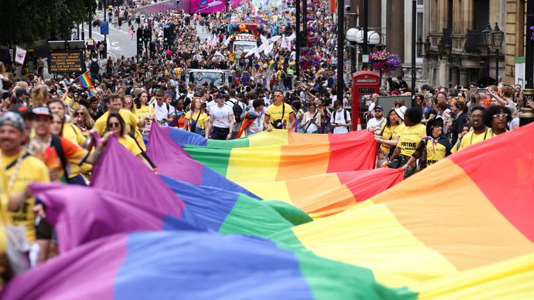 People carry a large rainbow flag, as they take part in the 2022 Pride Parade in London, Britain July 2, 2022. REUTERS/Henry Nicholls
