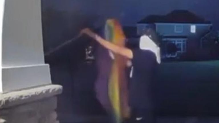 Video showing a masked individual taking down a pride flag from the front of a home in Utah has been shared as police ask for the publics help in identifying individuals responsible. 