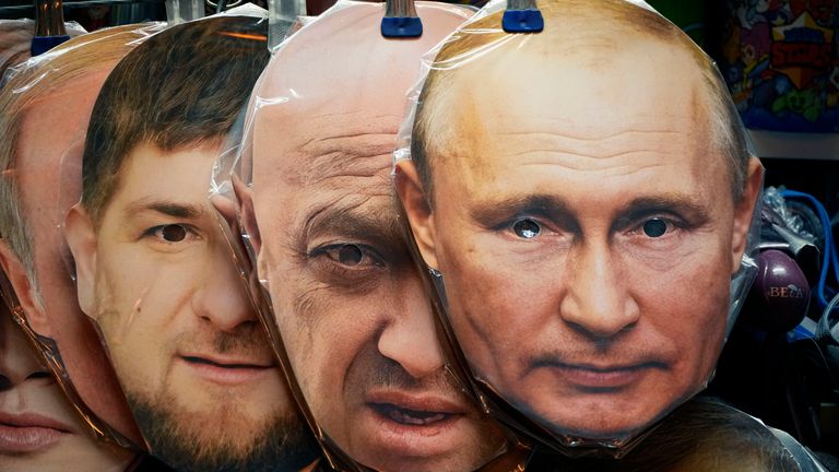 Face masks depicting Russian President Vladimir Putin, right, owner of private military company Wagner Group Yevgeny Prigozhin, centre, and Chechnya&#39;s regional leader Ramzan Kadyrov, left, are displayed among others for sale at a souvenir shop in St. Petersburg, Russia, Sunday, June 4, 2023. (AP Photo/Dmitri Lovetsky)