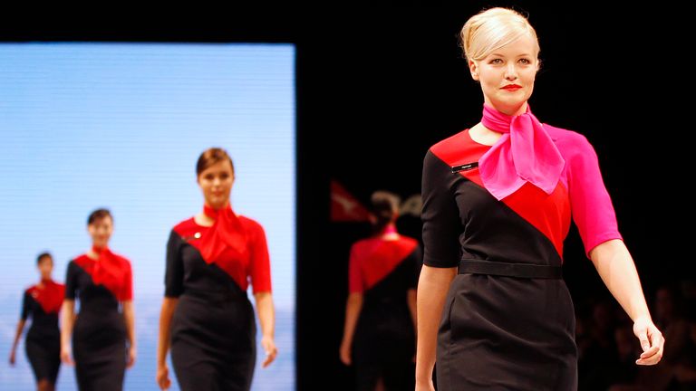 Qantas employees present the company uniform during a fashion show in Sydney April 2013. 
