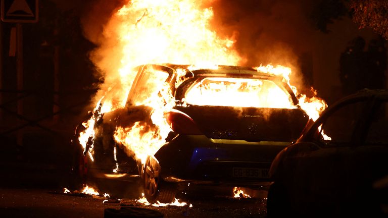 Vehicles burn during clashes between protesters and police, after the death of Nahel, a 17-year-old teenager killed by a French police officer during a traffic stop, in Nanterre, Paris suburb, France, June 28, 2023. REUTERS/Stephanie Lecocq
