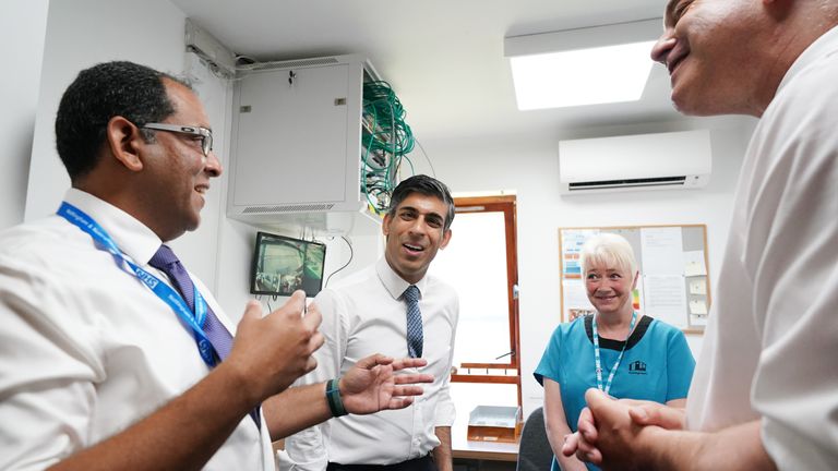 Prime Minister Rishi Sunak with Health Secretary Steve Barclay speaking to staff during a visit to Rivergreen Medical Centre in Nottingham 