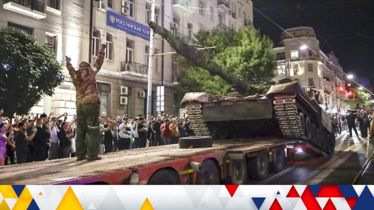 Members of the Wagner Group military company load their tank onto a truck on a street in Rostov-on-Don, Russia. Credit: AP