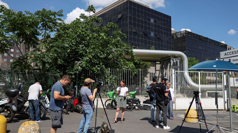 Members of the media work outside San Raffaele hospital where former Italian Prime Minister Silvio Berlusconi died in Milan, Italy, June 12, 2023. REUTERS/Claudia Greco
