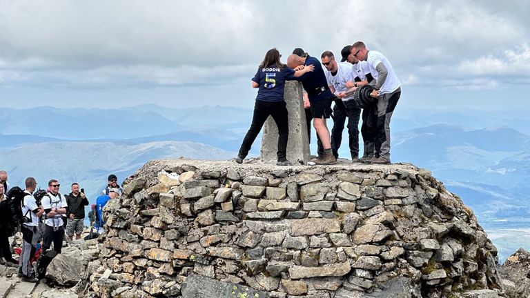 Mountain rescuer David Dooher climbing Ben Nevis. Pics via Story Shop