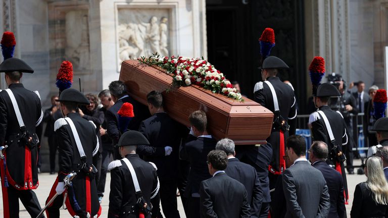 Pallbearers carry the coffin of former Italian Prime Minister Silvio Berlusconi during his funeral at the Duomo Cathedral, in Milan, Italy June 14, 2023. REUTERS/Claudia Greco