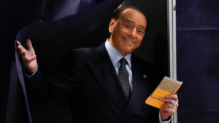 Silvio Berlusconi, leader of centre-right, populist Forza Italia comes out of a voting booth  
Pic:AP