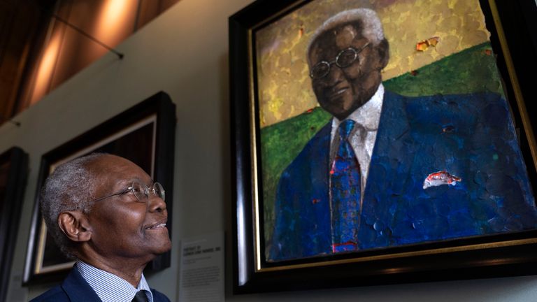 Handout photo issued by Royal Collection Trust of Professor Sir Geoff Palmer posing alongside his portrait in the new display Windrush: Portraits of a Pioneering Generation, at the Palace of Holyroodhouse. The series of portraits have been commissioned by King Charles III to honour the pioneering men and women who came over to the UK on the HMT Empire Windrush, and the generations who followed. Issue date: Wednesday June 21, 2023.