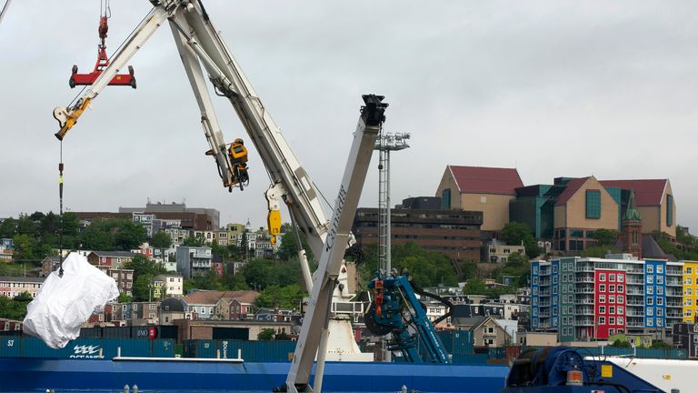 Debris from the Titan submersible, recovered from the ocean floor near the wreck of the Titanic, is unloaded from the ship Horizon Arctic at the Canadian Coast Guard pier in St. John&#39;s, Newfoundland 
Pic:The Canadian Press/AP