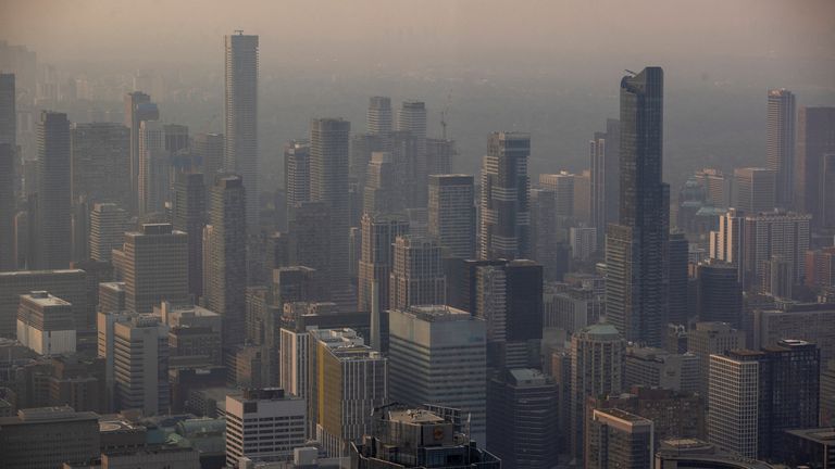 A smokey Toronto skyline is seen from the CN Tower as wildfires in Ontario and Quebec continue to burn, in Toronto, Ontario, Canada June 6, 2023. REUTERS/Carlos Osorio