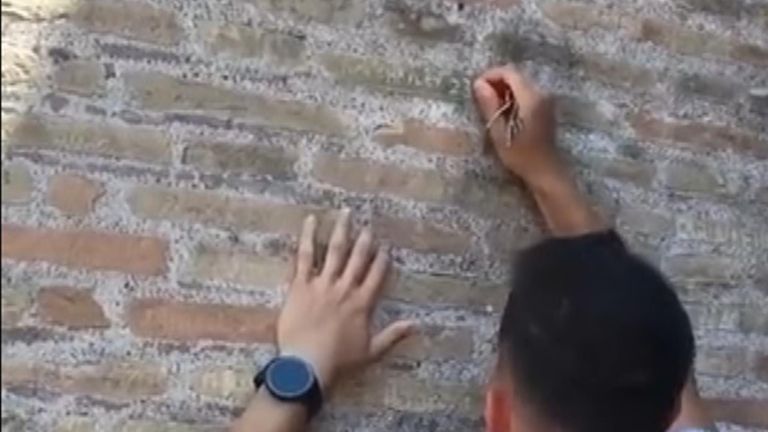 Anger in Italy as tourist filmed carving names into the Colosseum