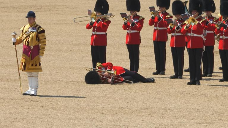 Guardsman lies on the floor during rehearsals for Trooping the Colour